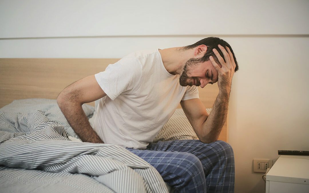 Man waking up with back pain