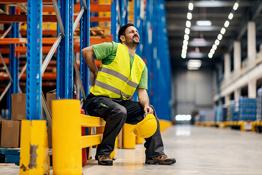 Warehouse worker with back pain