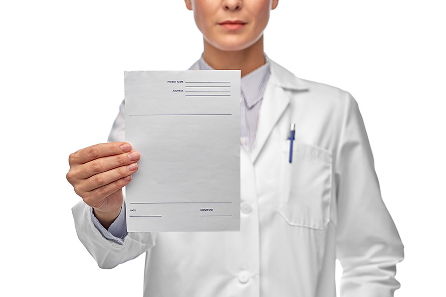 Physician holding a prescription